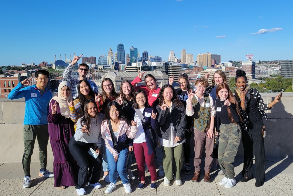 Scholars in front of the Kansas City Skyline